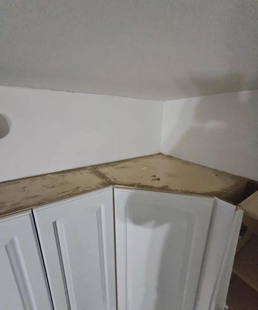 Dusty kitchen cabinets before deep cleaning in Chicago