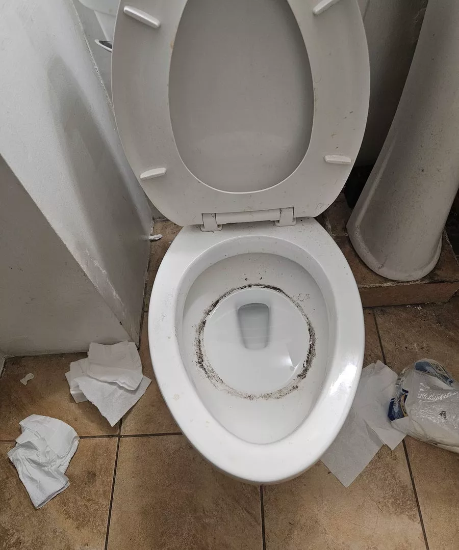 Bathroom in need of deep cleaning before service